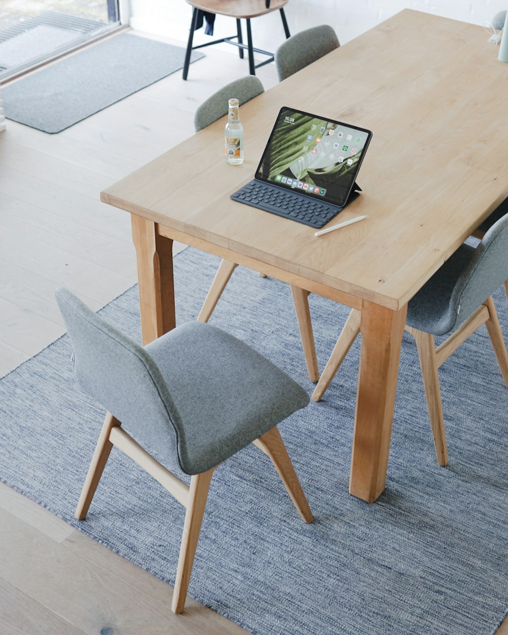 black laptop computer on brown wooden table