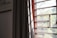 A bright room featuring elegant roller shades that enhance natural light control.
