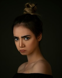 woman with brown hair and black eyes