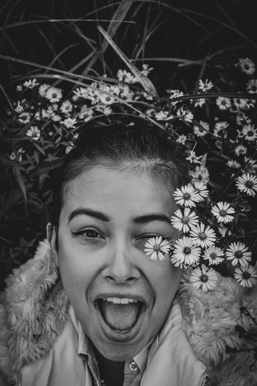 grayscale photo of smiling woman