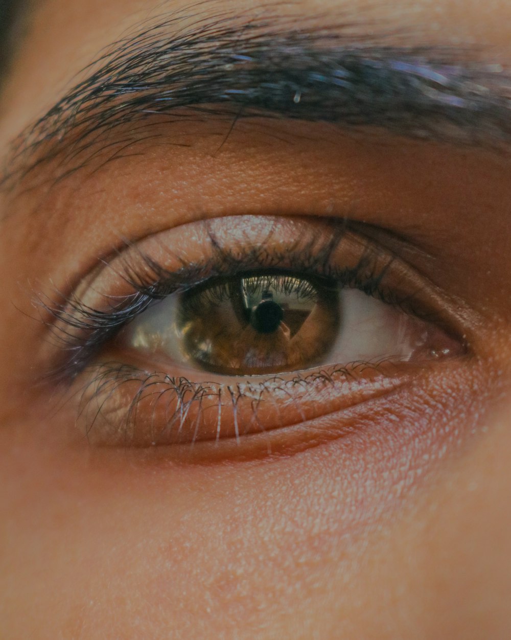 persons eye in close up photography