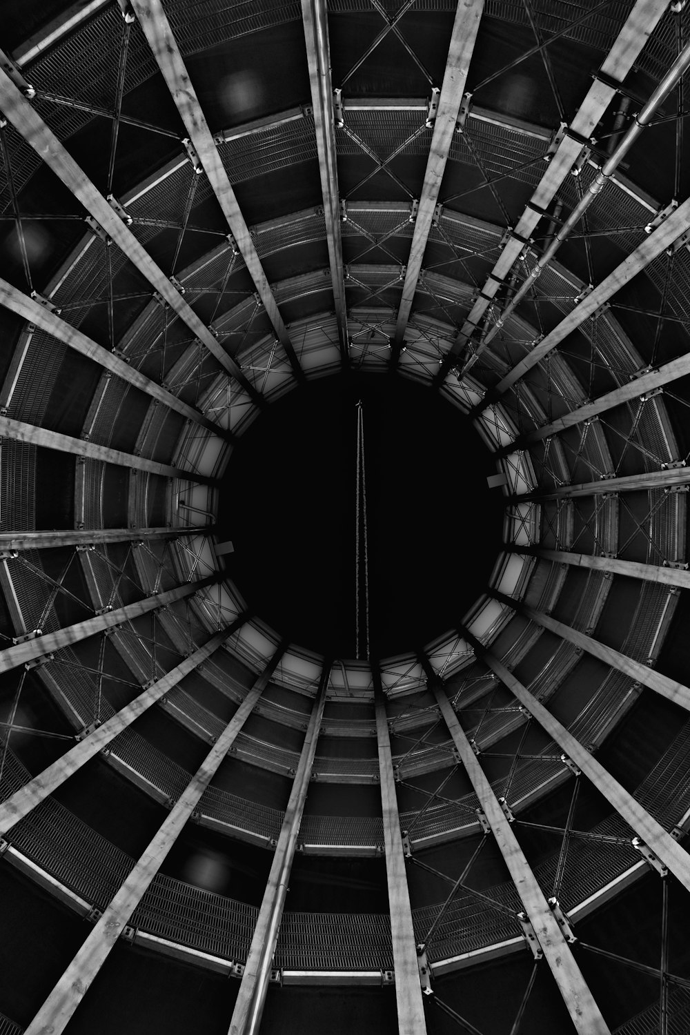 grayscale photo of a tunnel
