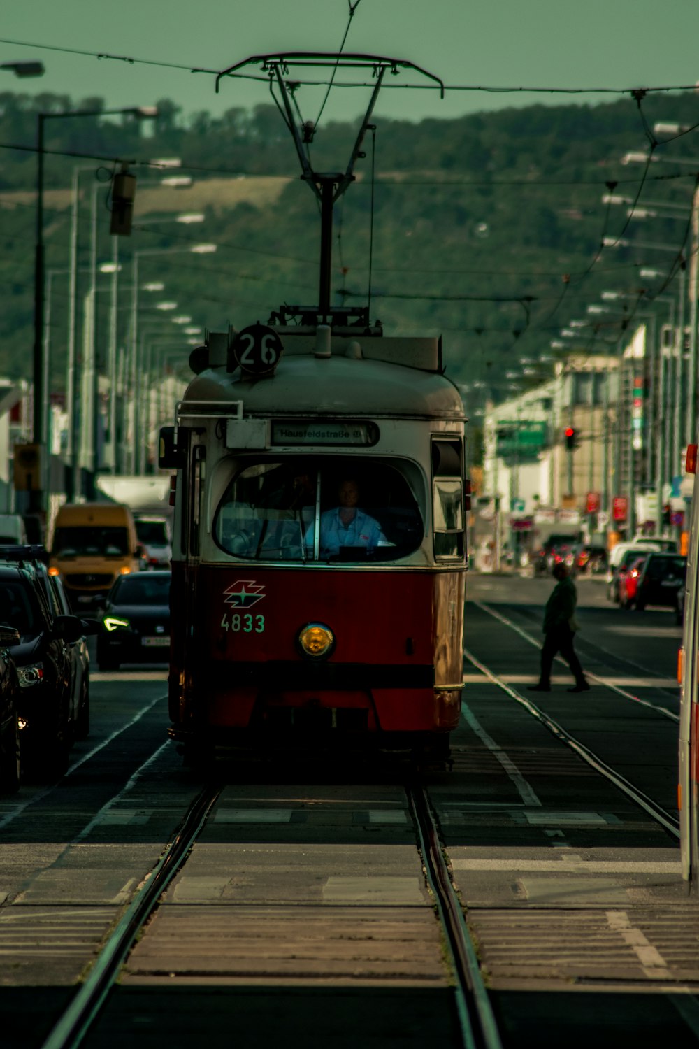 red and white tram on the street