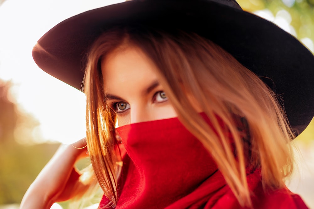 woman in red hijab taking selfie