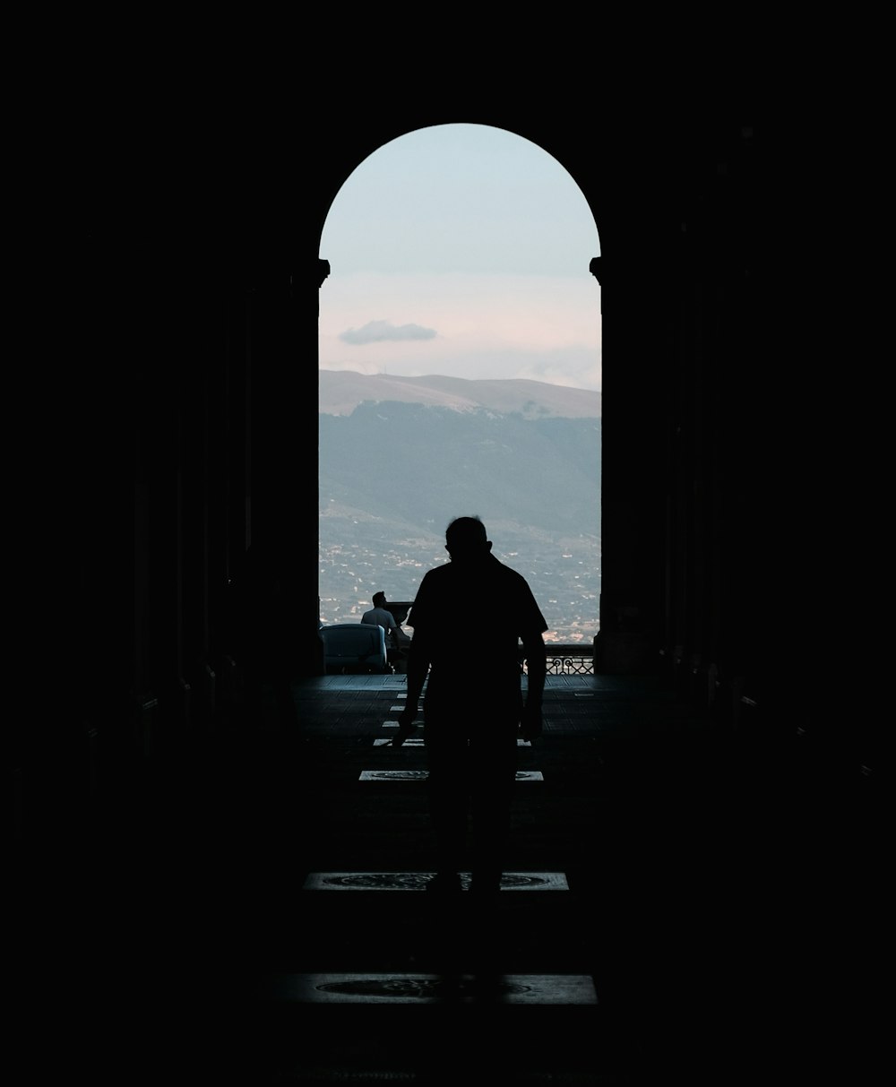 silhouette of man and woman sitting on bench