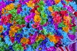A beautifully arranged artificial flower bouquet in vibrant colors.