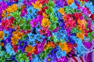 A vibrant arrangement of colorful artificial flowers.