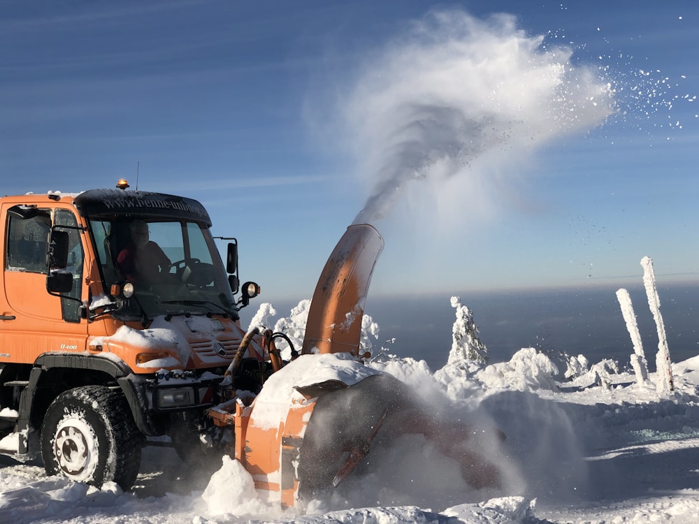 black and orange snow covered mountain during daytime