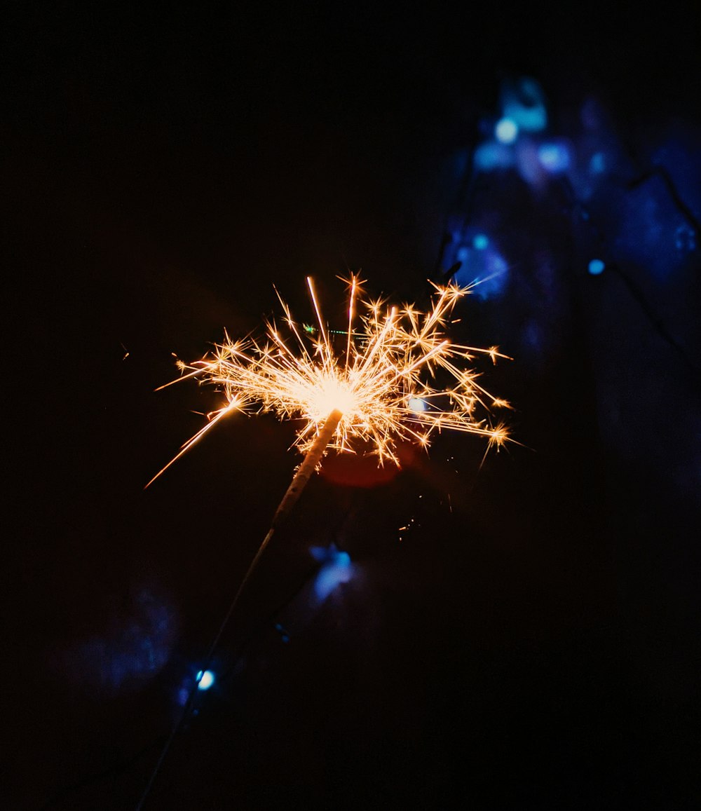 white and yellow fireworks in the sky