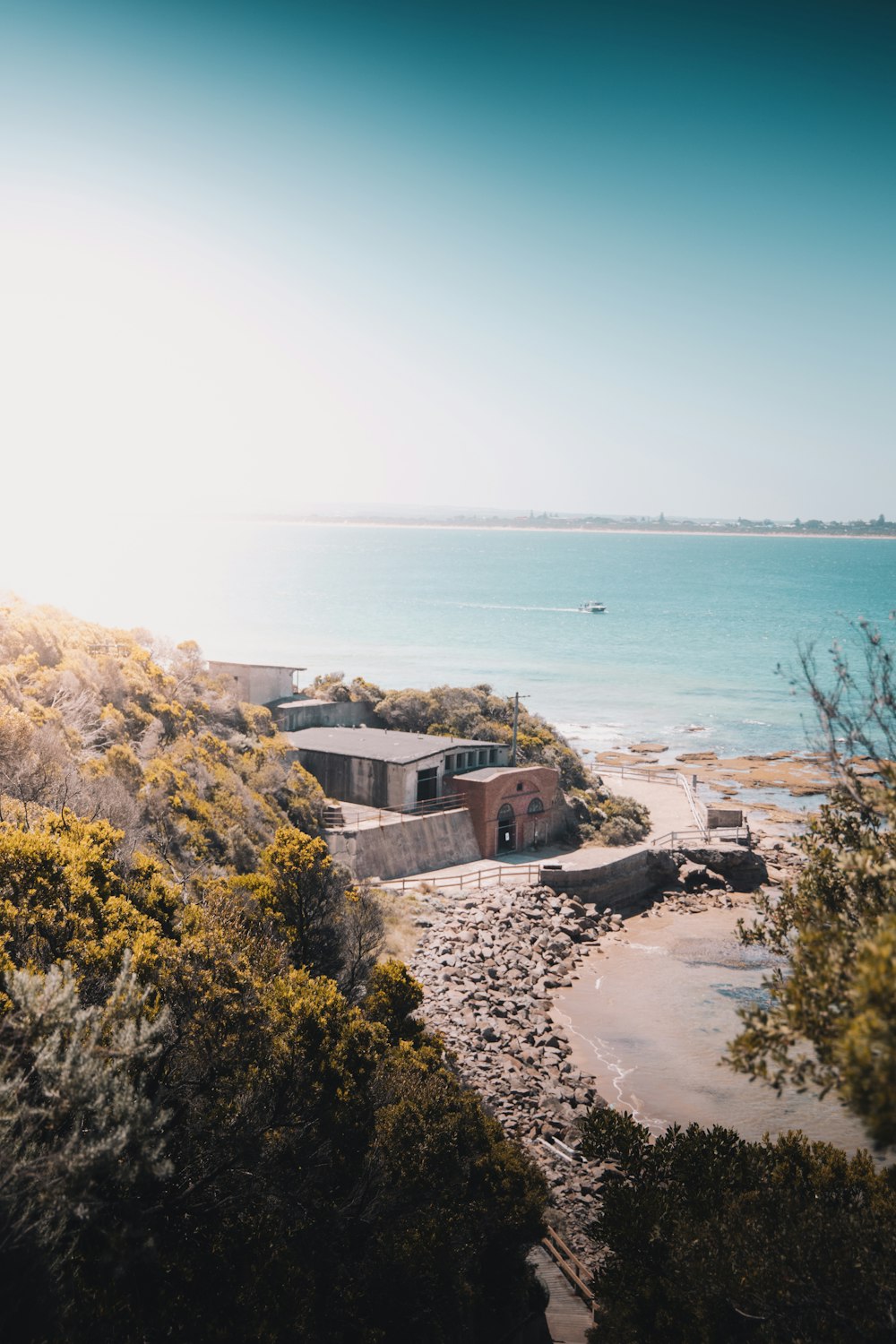 brown concrete building near body of water during daytime