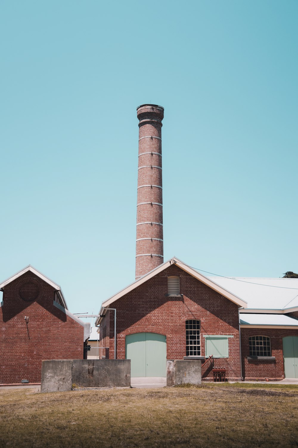 brown and white concrete building under blue sky during daytime