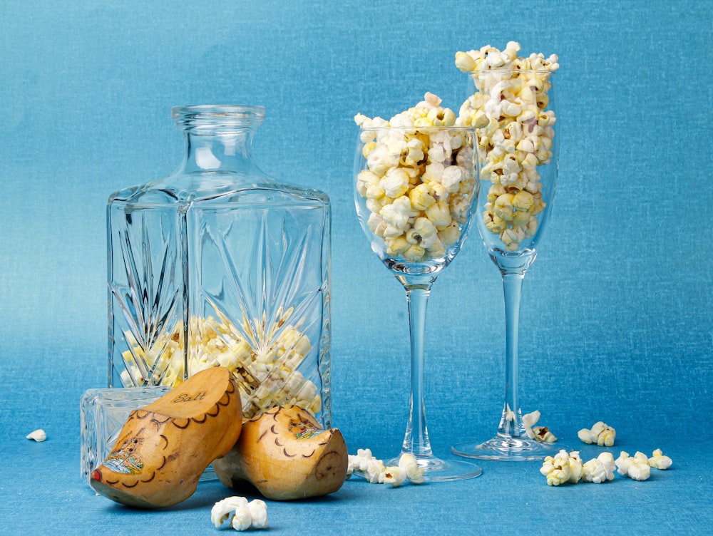 clear glass bottle with white flowers