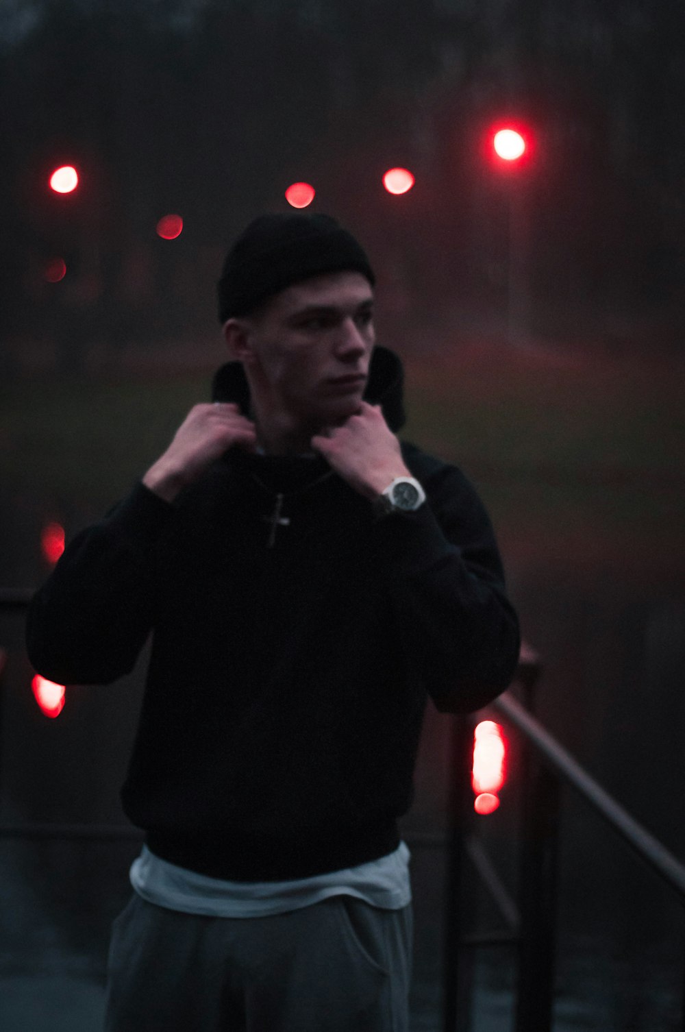 man in black jacket smoking cigarette