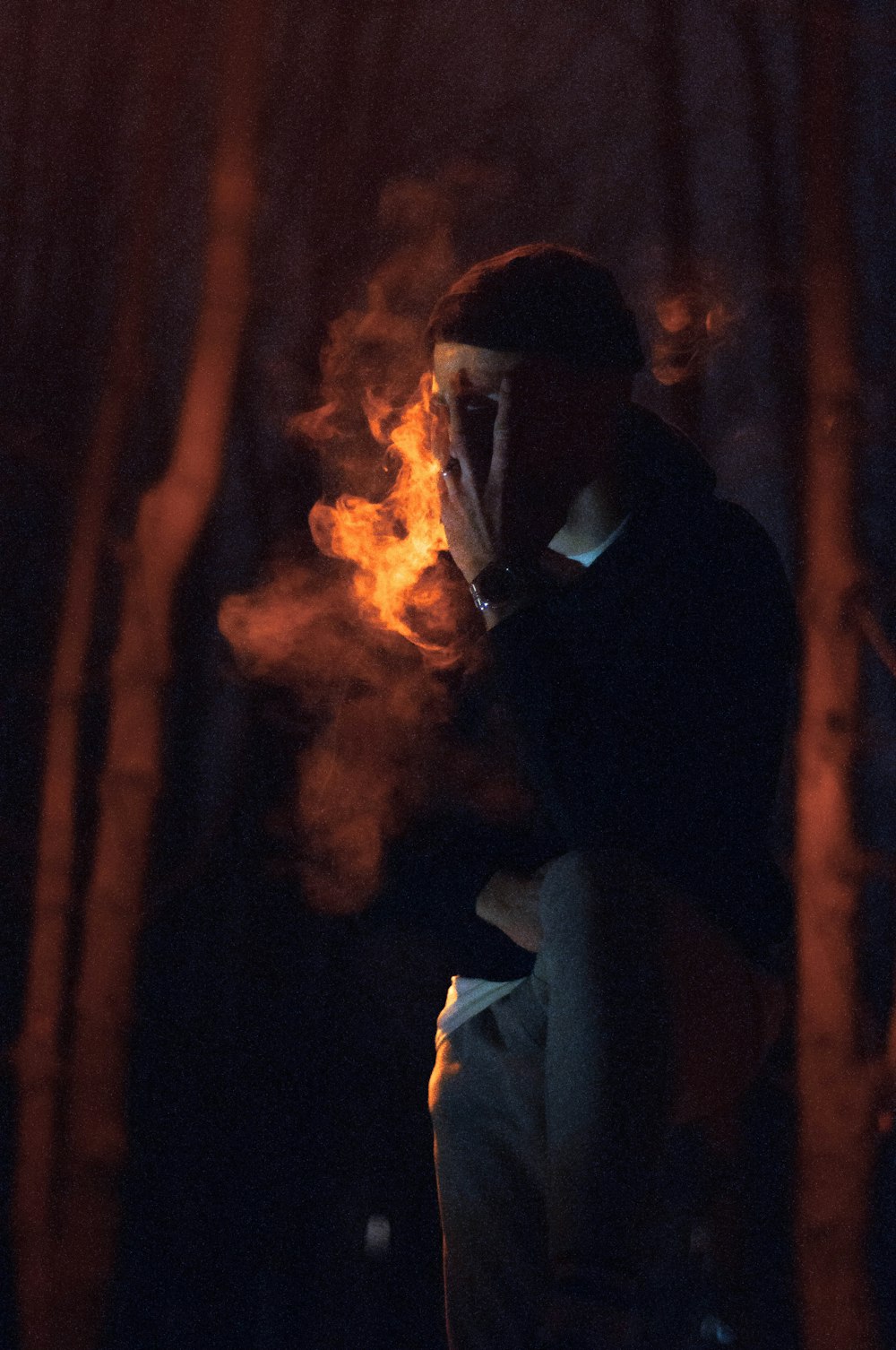 man in black jacket smoking