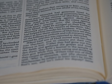 Close-up of a scientific journal open to a detailed research article with graphs and data.