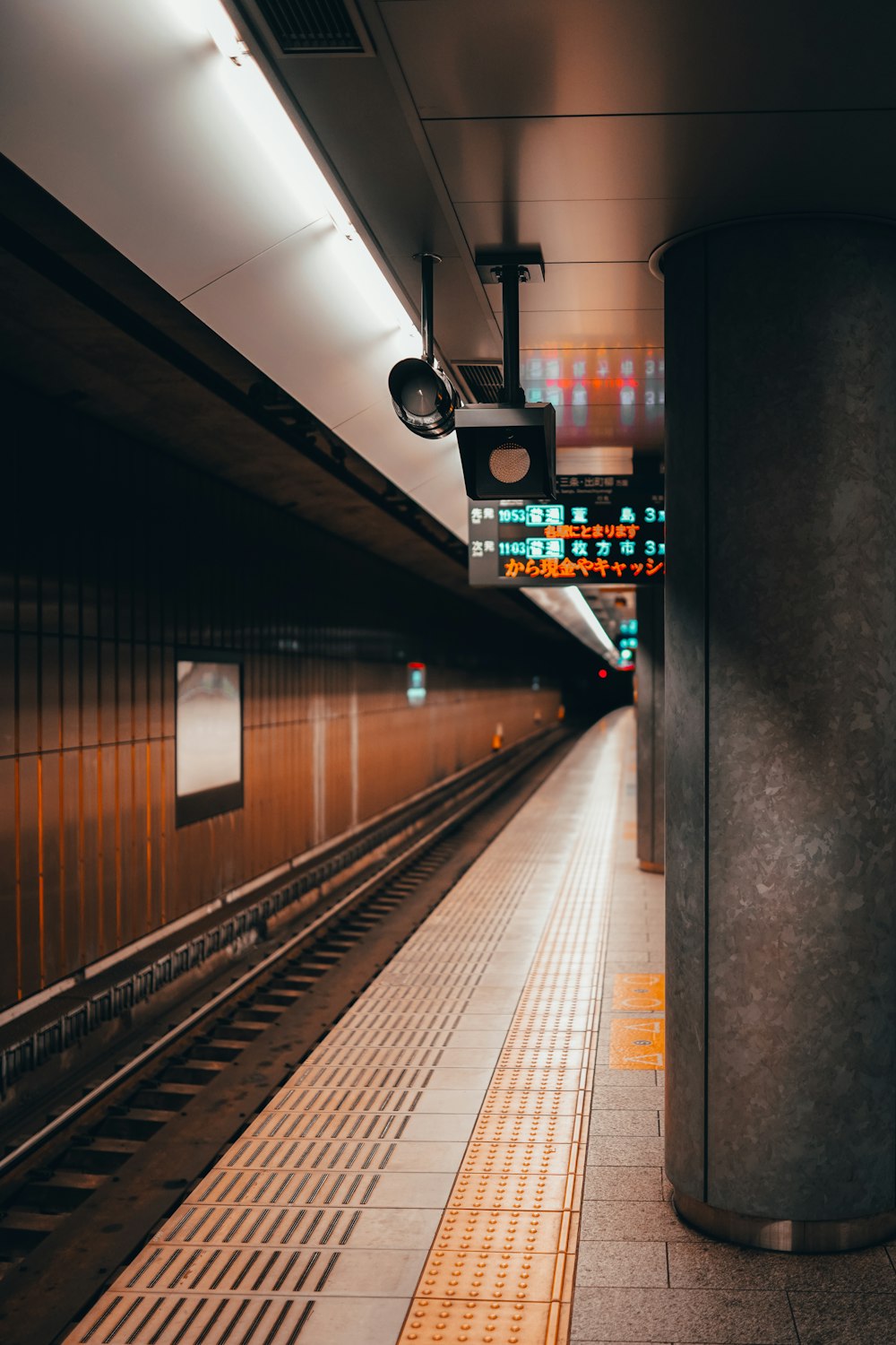 train station with lights turned on during night time