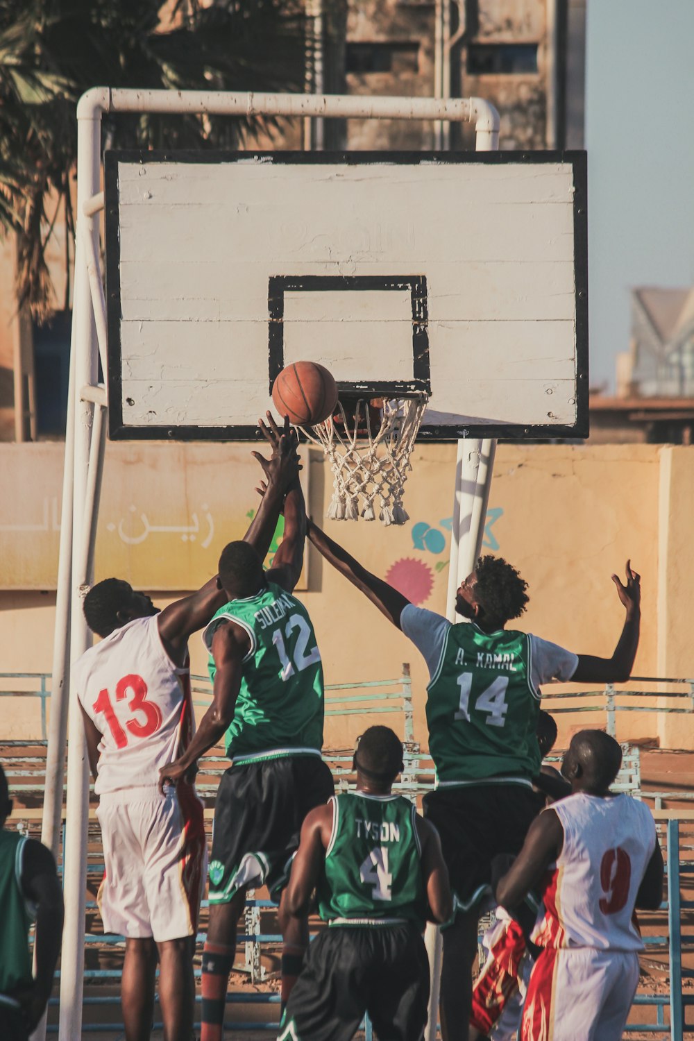 basketball players playing on court