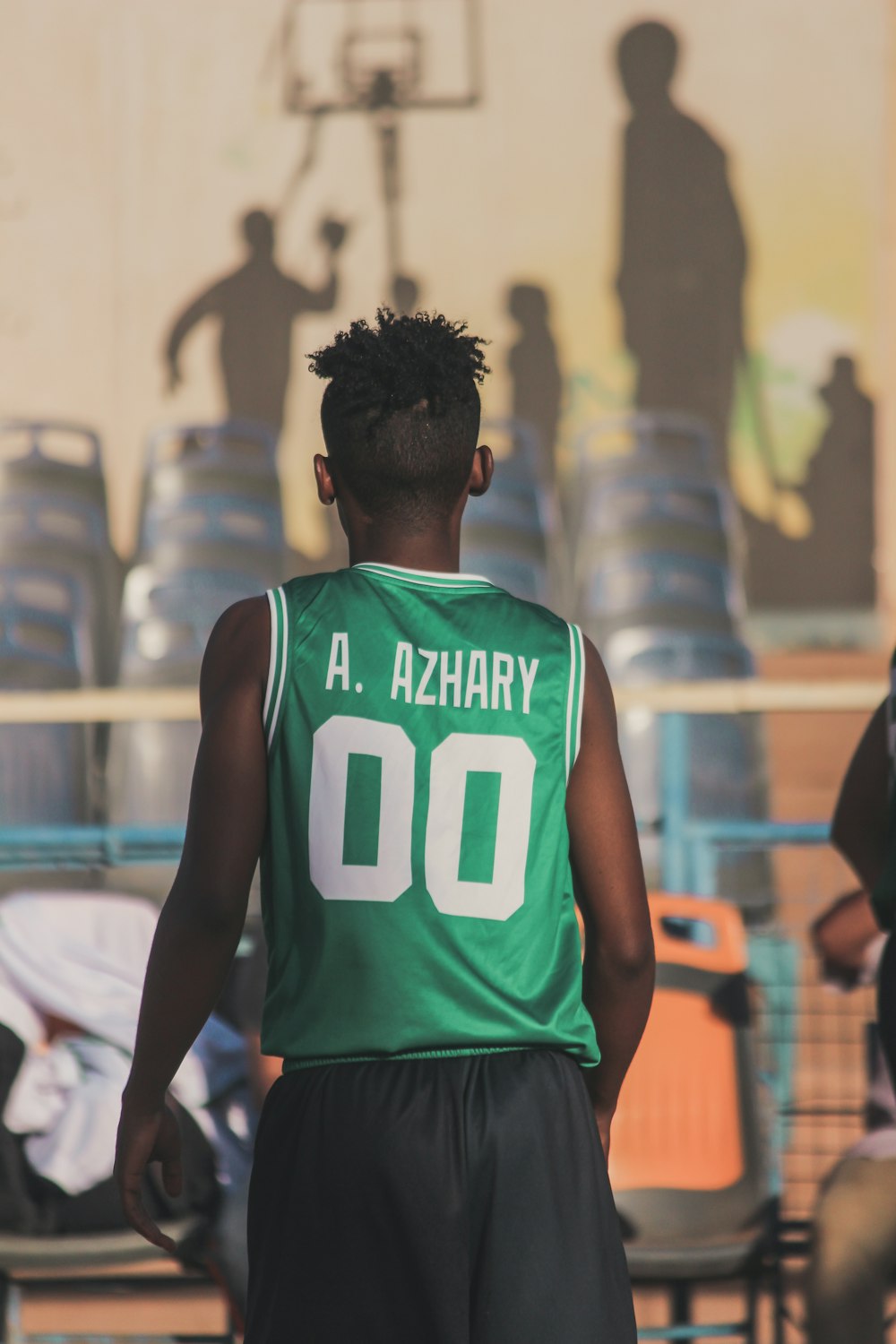 man in green and white nike tank top