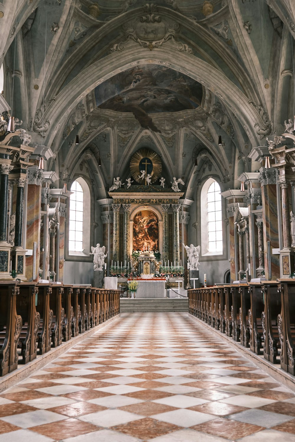 brown wooden bench inside cathedral