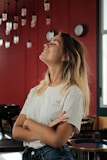 woman in white crew neck t-shirt sitting on chair