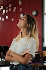woman in white crew neck t-shirt sitting on chair