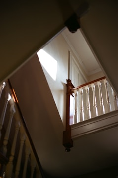 A beautifully installed hardwood staircase bathed in natural light.