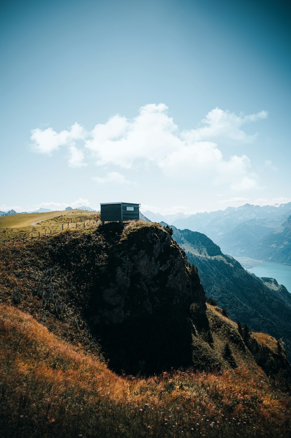 gray and black house on top of mountain during daytime