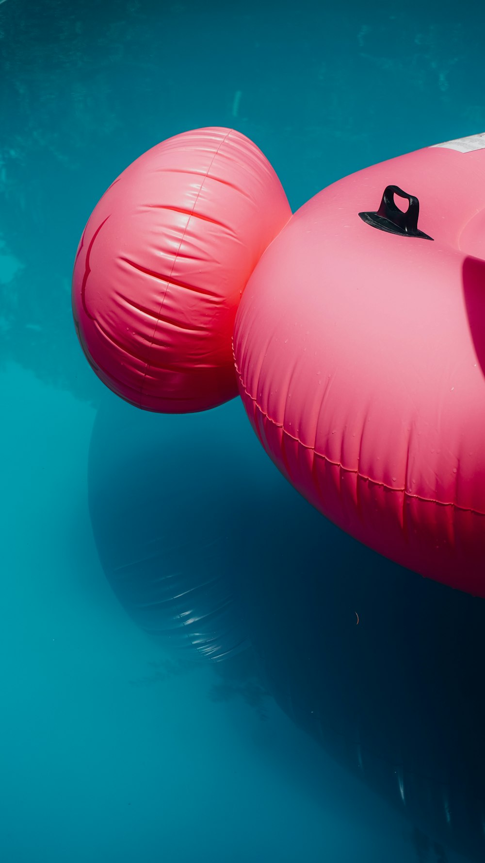 red inflatable ball with blue background