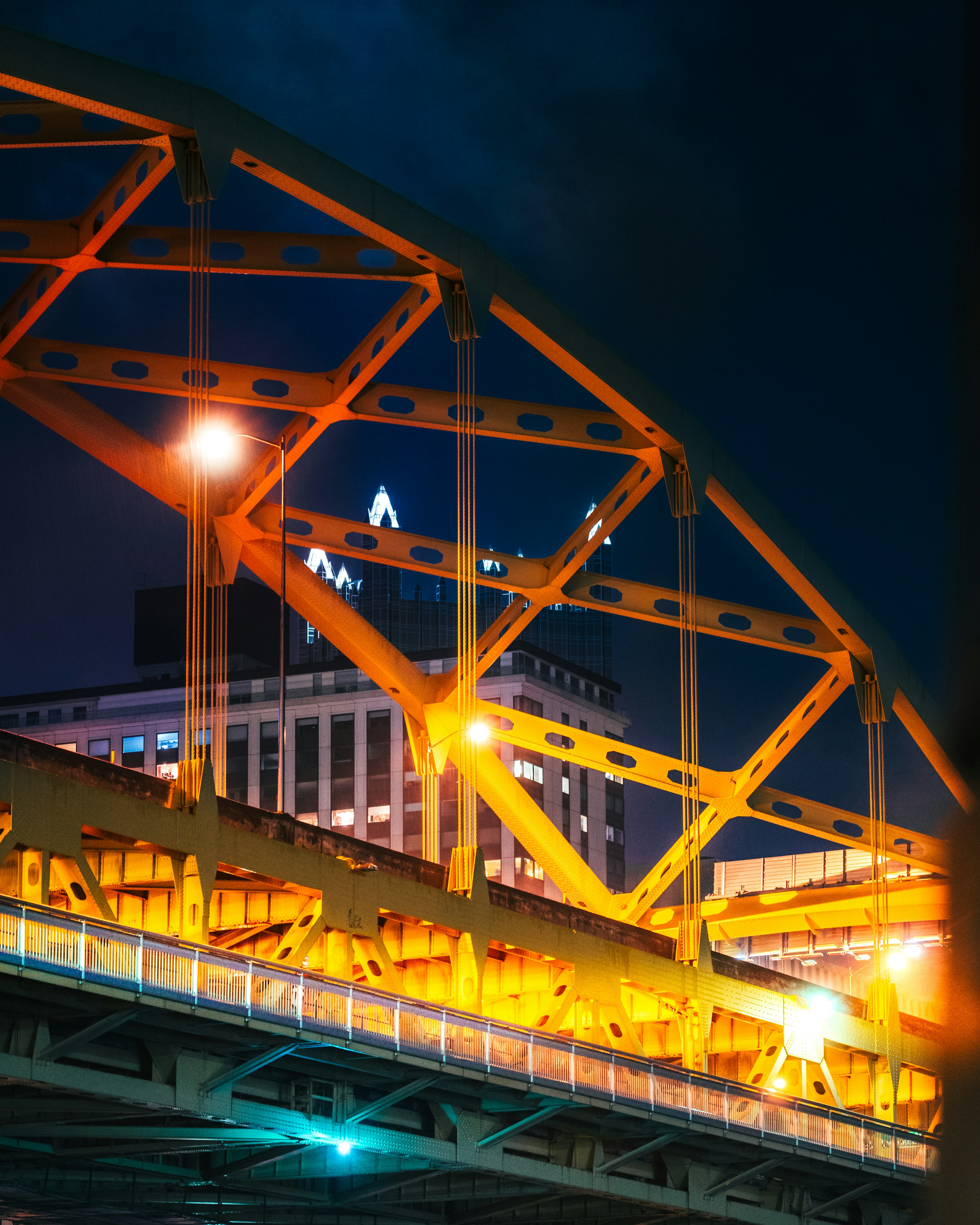 yellow lighted bridge during night time