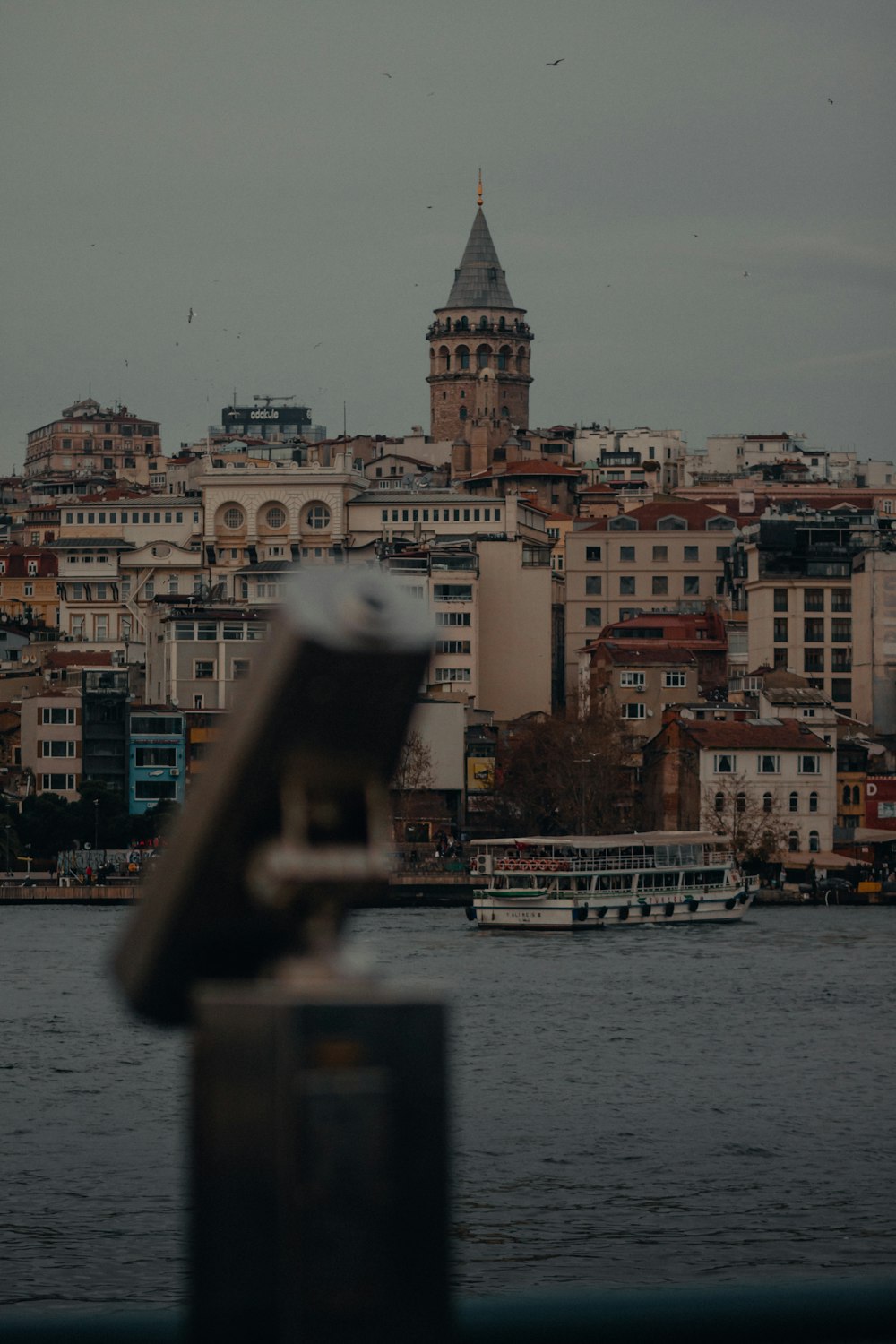 brown concrete building near body of water during daytime