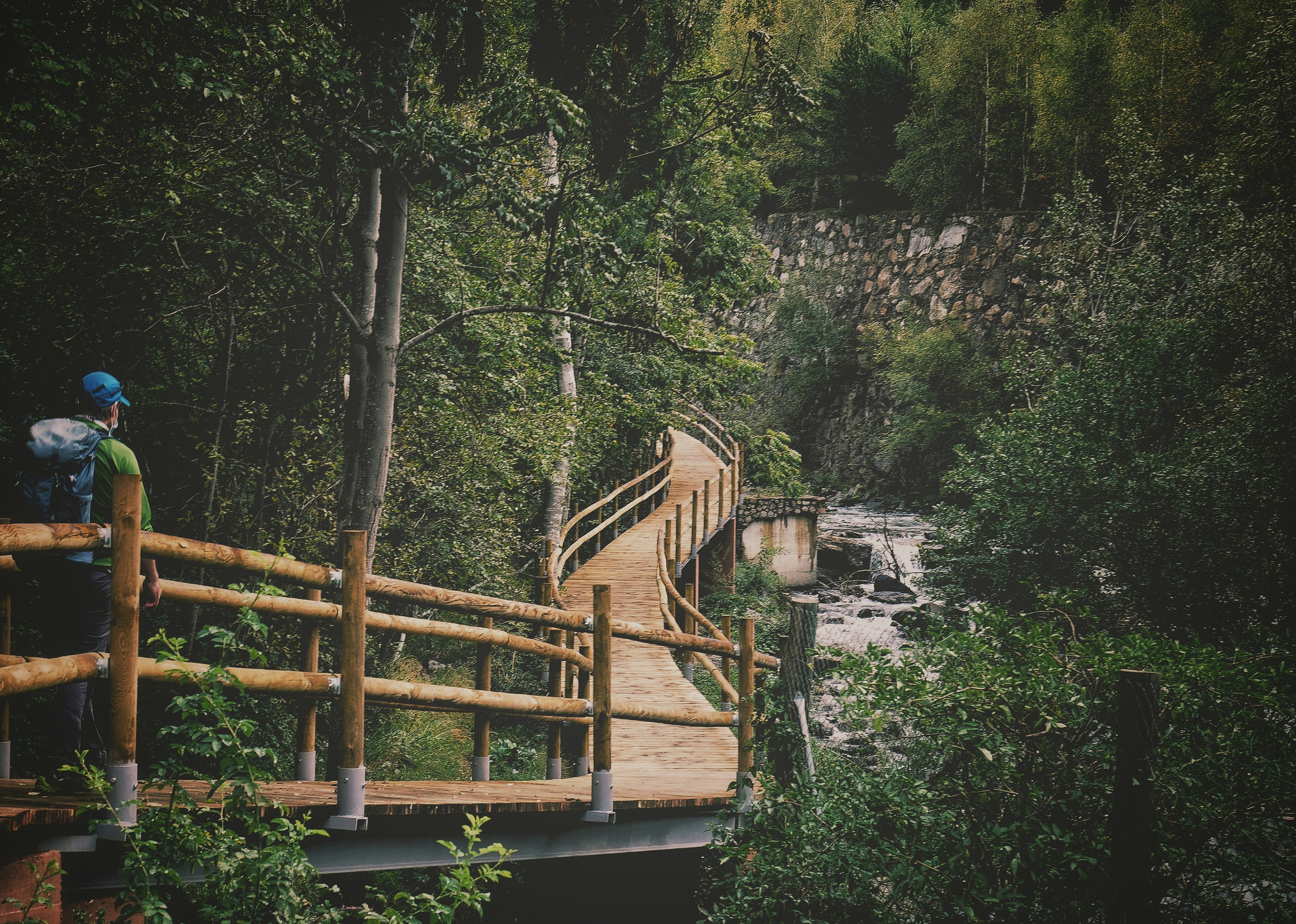 brown wooden bridge over river