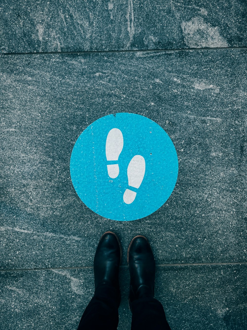 person standing on black and white heart print floor