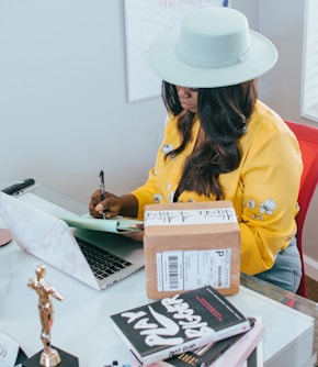 woman in yellow long sleeve shirt wearing white cowboy hat