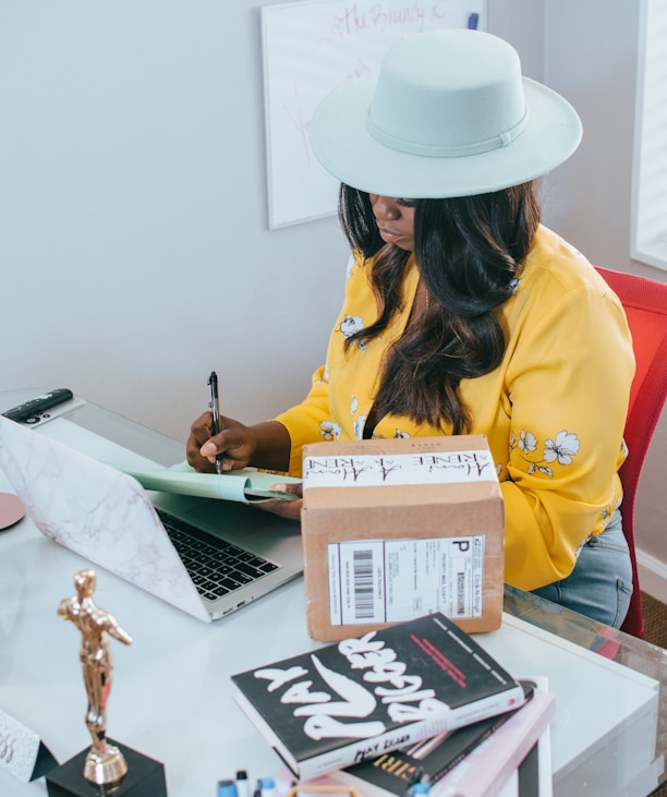 woman in yellow long sleeve shirt wearing white cowboy hat