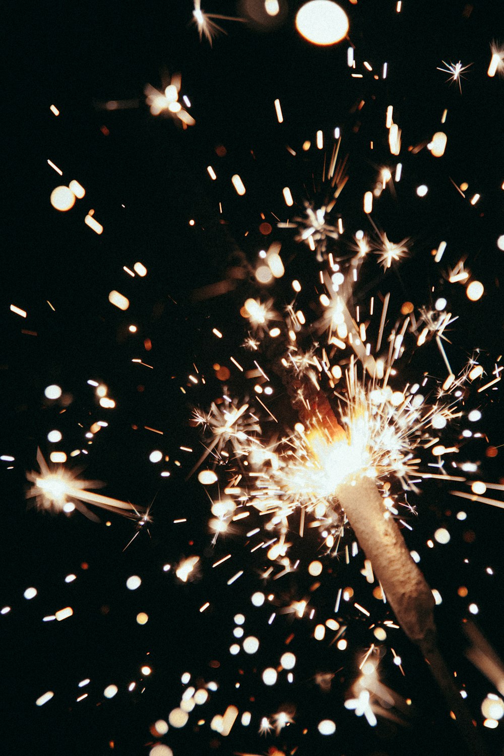 a close up of a sparkler on a black background