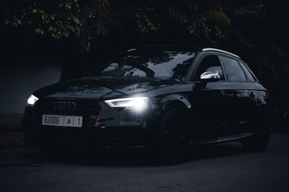 black bmw m 3 coupe parked on road during daytime