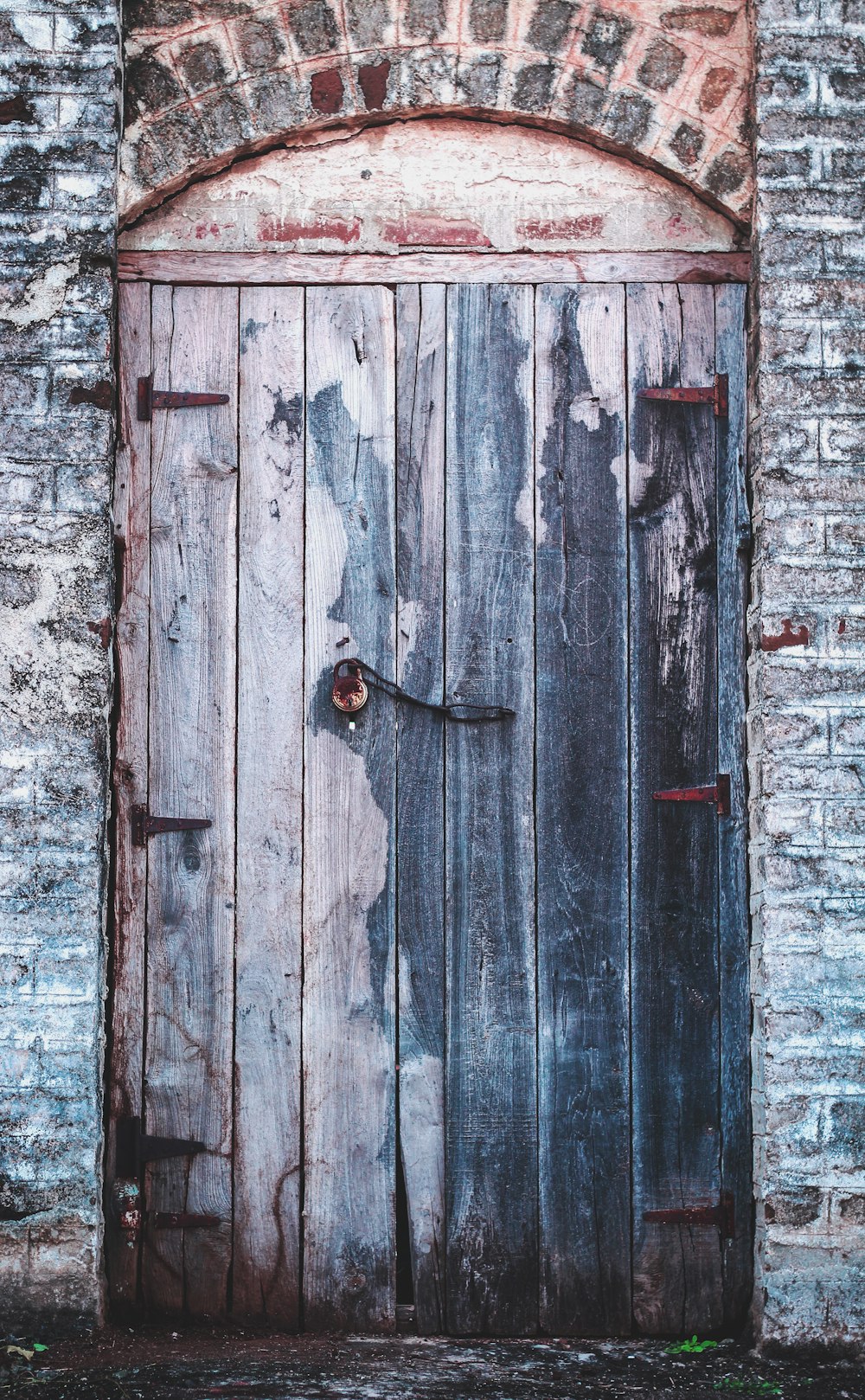 black wooden door with black door knob