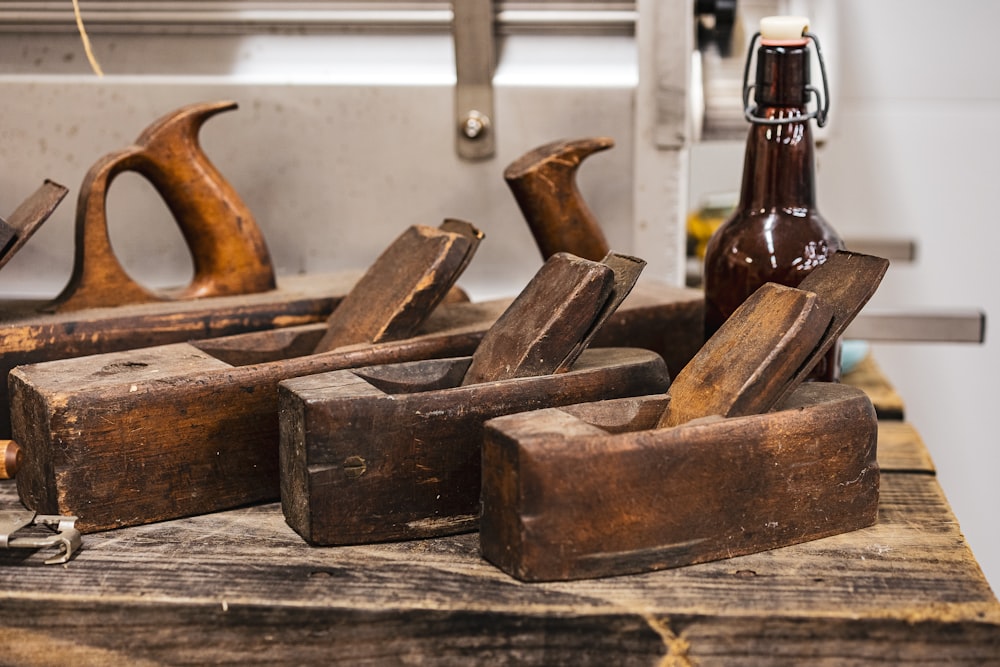 brown glass bottles on wooden table