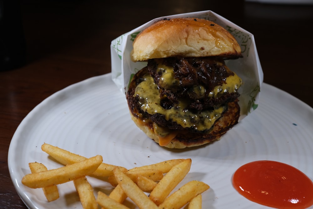 burger with fries on white paper plate