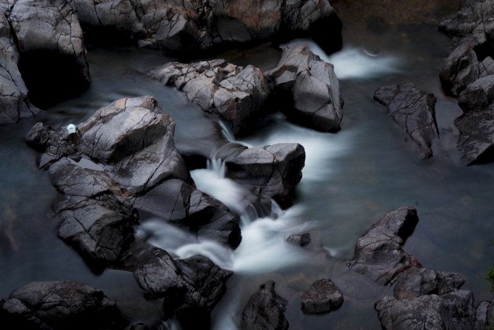 brown rocks on body of water