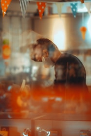 man in black shirt sitting on chair