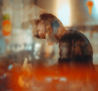 man in black shirt sitting on chair