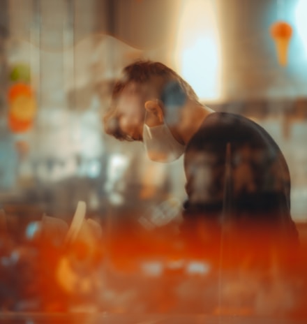 man in black shirt sitting on chair