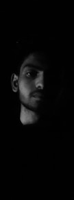 mans face in grayscale photography