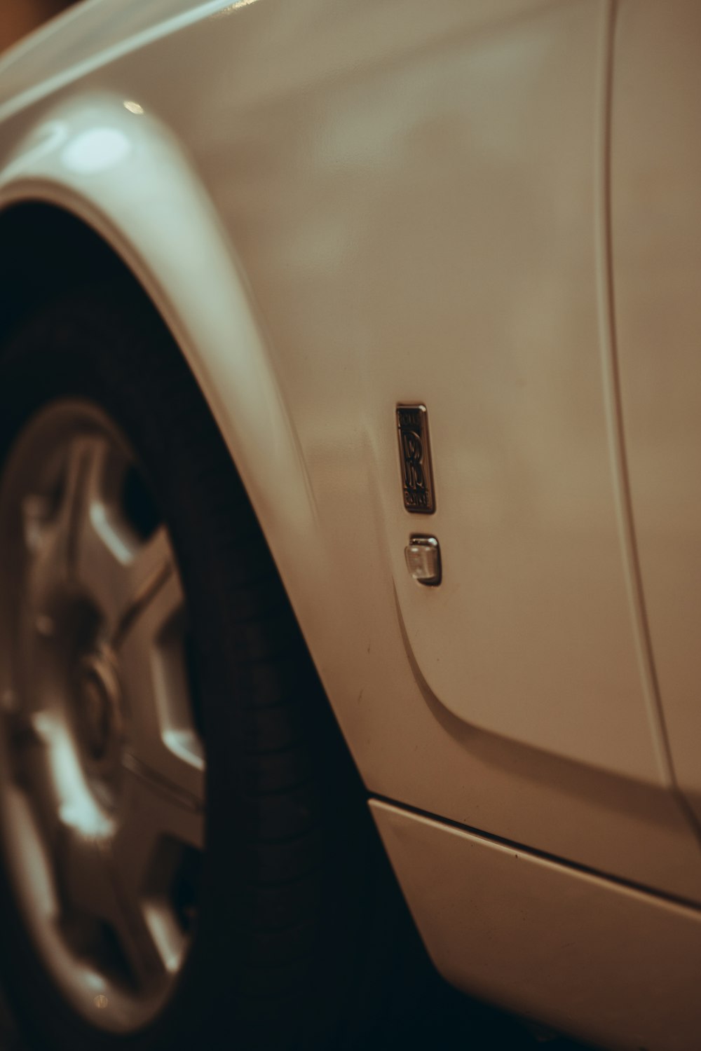 white car with black wheel