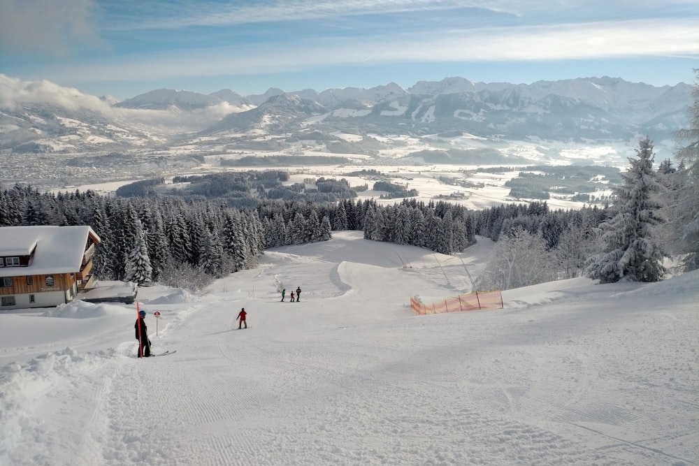 people walking on snow covered field during daytime