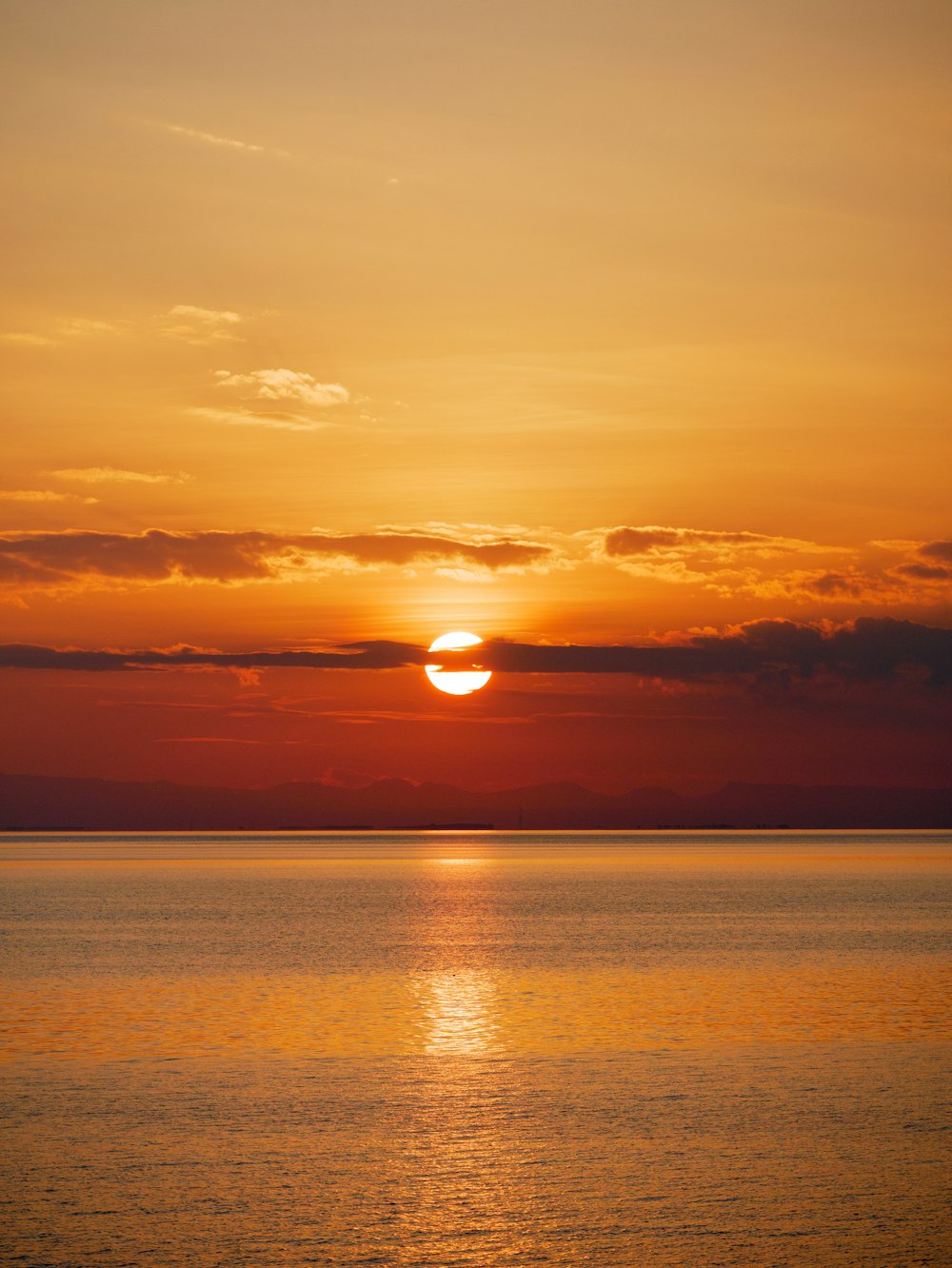 body of water during sunset