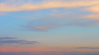 Anime-style guild members standing together under a pastel blue sky with soft clouds.