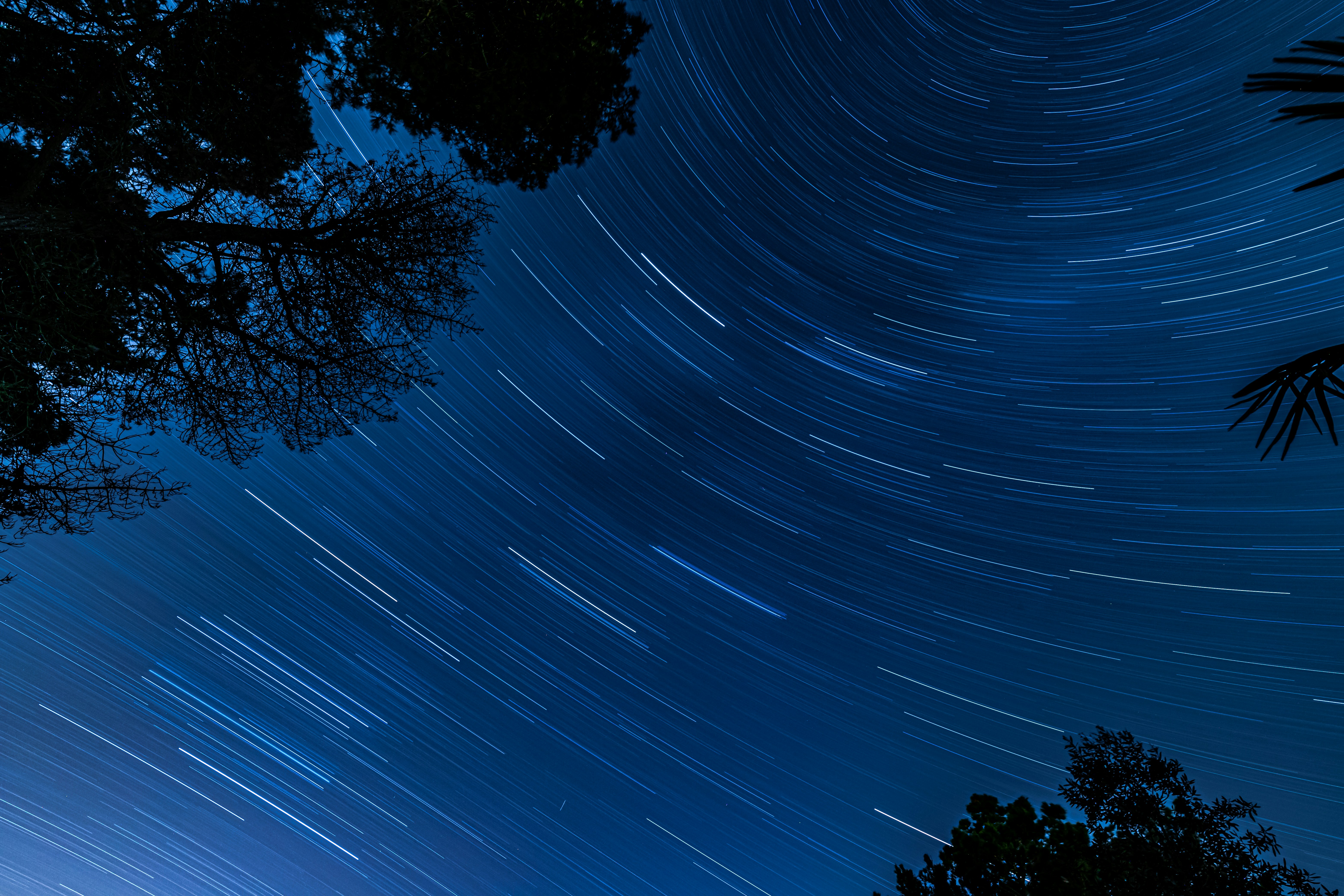 time lapse photography of stars in the sky during night time
