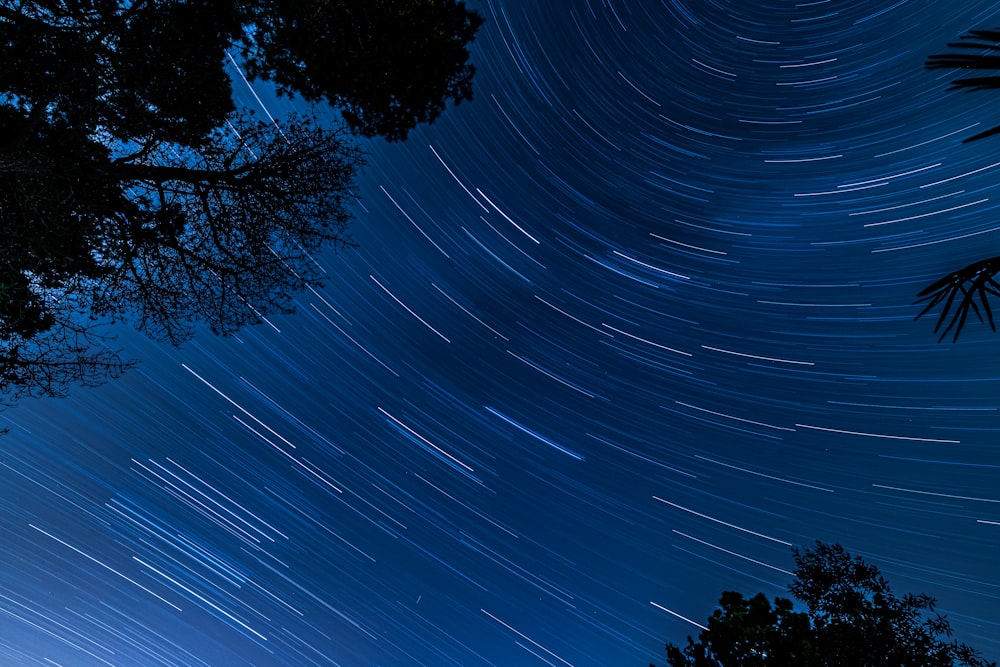 time lapse photography of stars in the sky during night time